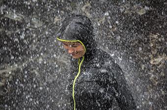 Arc'teryx Norvan SL Hoody (standing under waterfall)