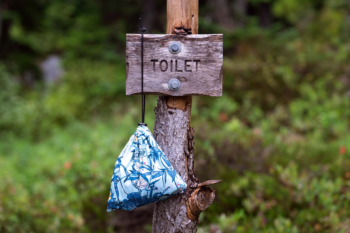 Blackstrap stuff sack as toilet bag (hanging from sign)