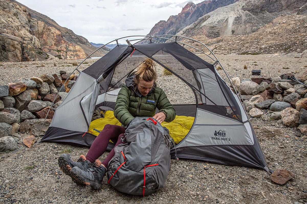 Budget backpacking tent (reaching into pack in REI Trail Hut 2)