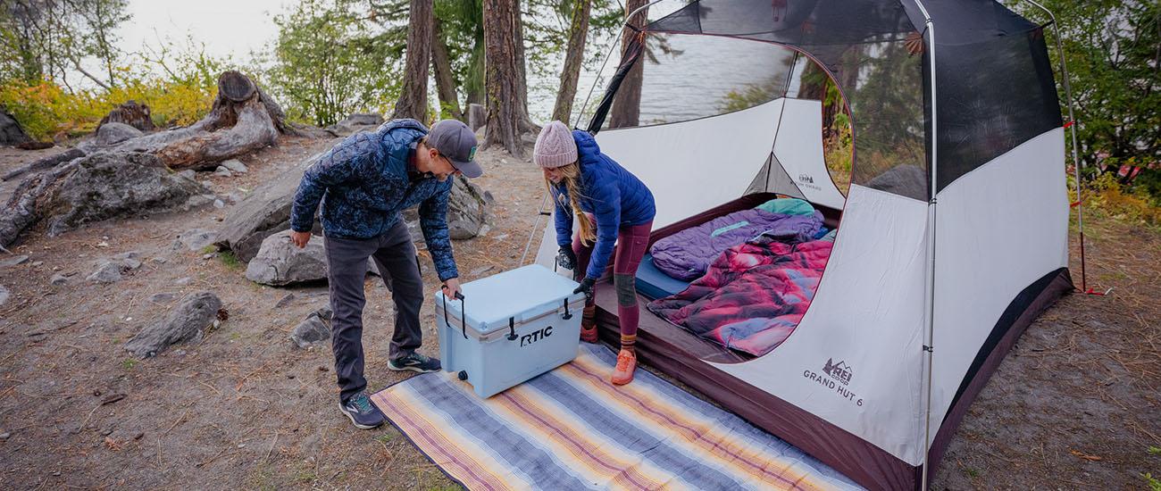 Camping gear (putting cooler down at camp)