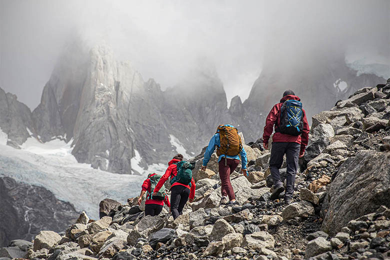 Hiking daypacks (group hiking toward mountains)