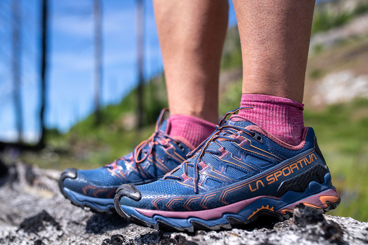 Hiking shoes (standing on rock in La Sportiva Ultra Raptor II)