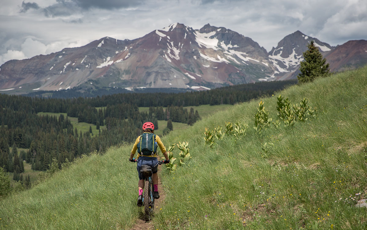 Mountain bikes under %241%2C500 (riding toward stormy mountains)