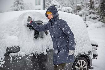 Patagonia Tres 3-in-1 Parka (wiping off snow-covered car)