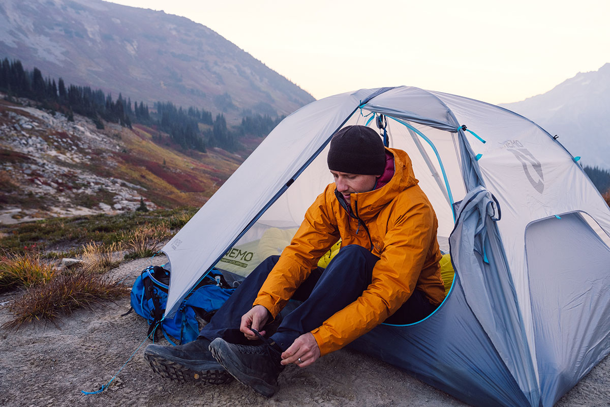 Rain jacket (tying shoes in tent)