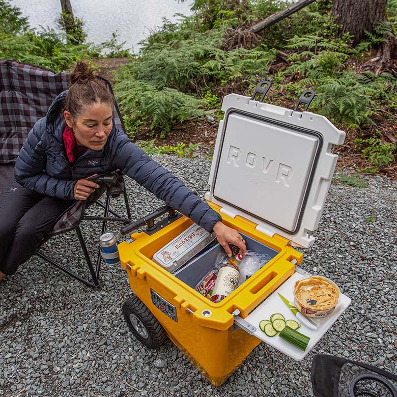 RovR RollR 45 wheeled cooler (reaching in to grab wine)