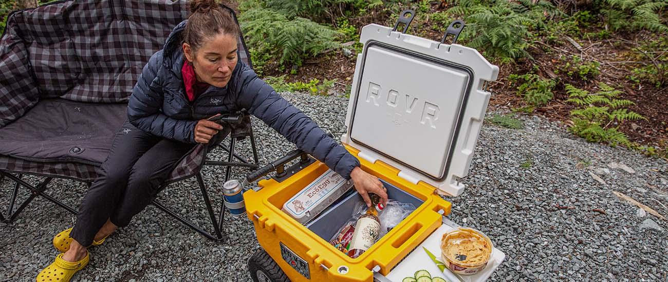 RovR RollR 45 wheeled cooler (reaching in to grab wine)