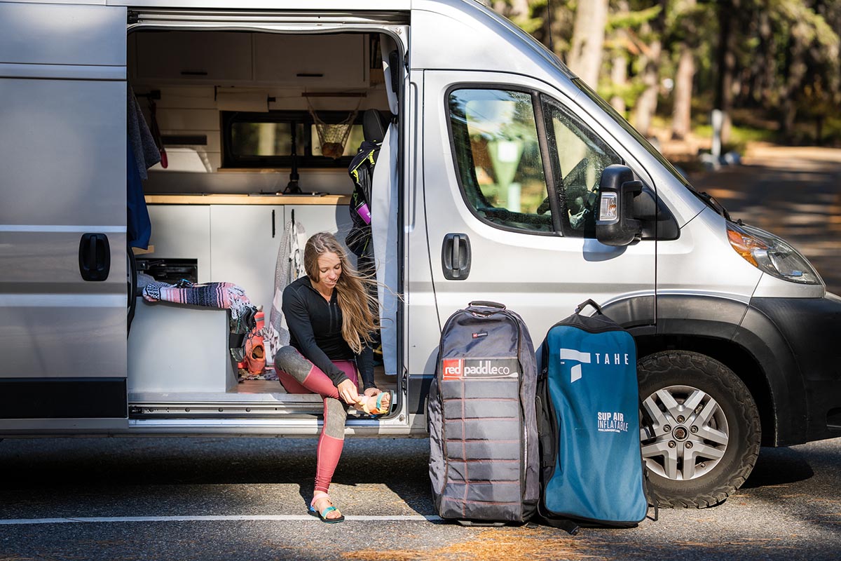 Sports sandal (putting on Teva Original Universal in van)